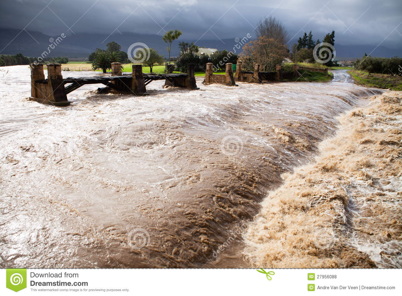 Flood River With Red Alluvial Flowing In Dak Lak, Vietnam Stock. Flood River With Red Alluvial Flowing In Dak Lak, Vietnam Stock.