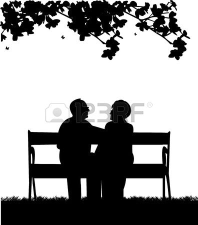 Lovely retired elderly couple sitting on bench in garden or.