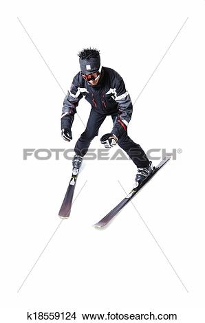 Stock Photo of One male skier skiing without sticks on a white.