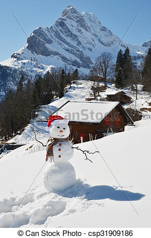 Pictures of Snowman against Alpine panorama csp31909186.
