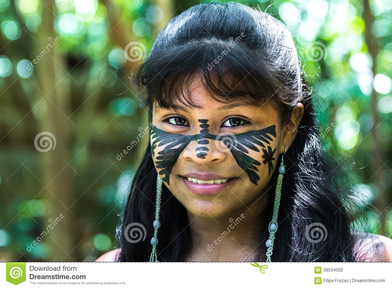 Native Brazilian Girl Smiling At An Indigenous Tribe In The Amazon.