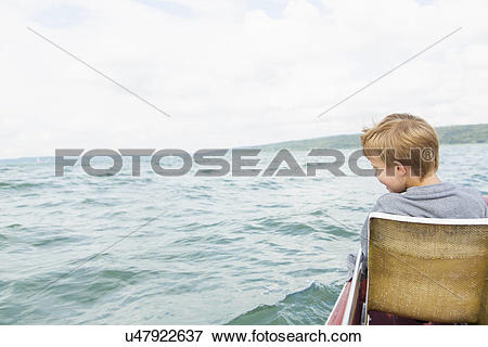 Picture of Young boy on pedalo, Lake Ammersee, Bavaria, Germany.