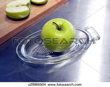 Stock Photo of Grater made of glass with an apple u29965504.