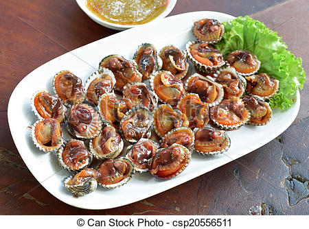 Stock Photography of Steamed blanched clams with dipping sauce.
