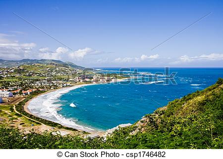 Stock Photo of Crystal Blue Bay Down Green Hill.