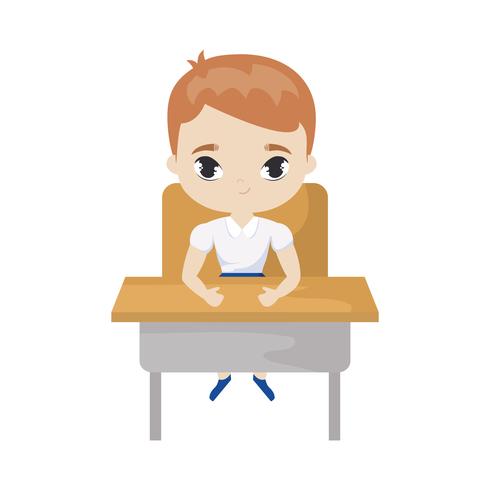 little student boy sitting in school desk.