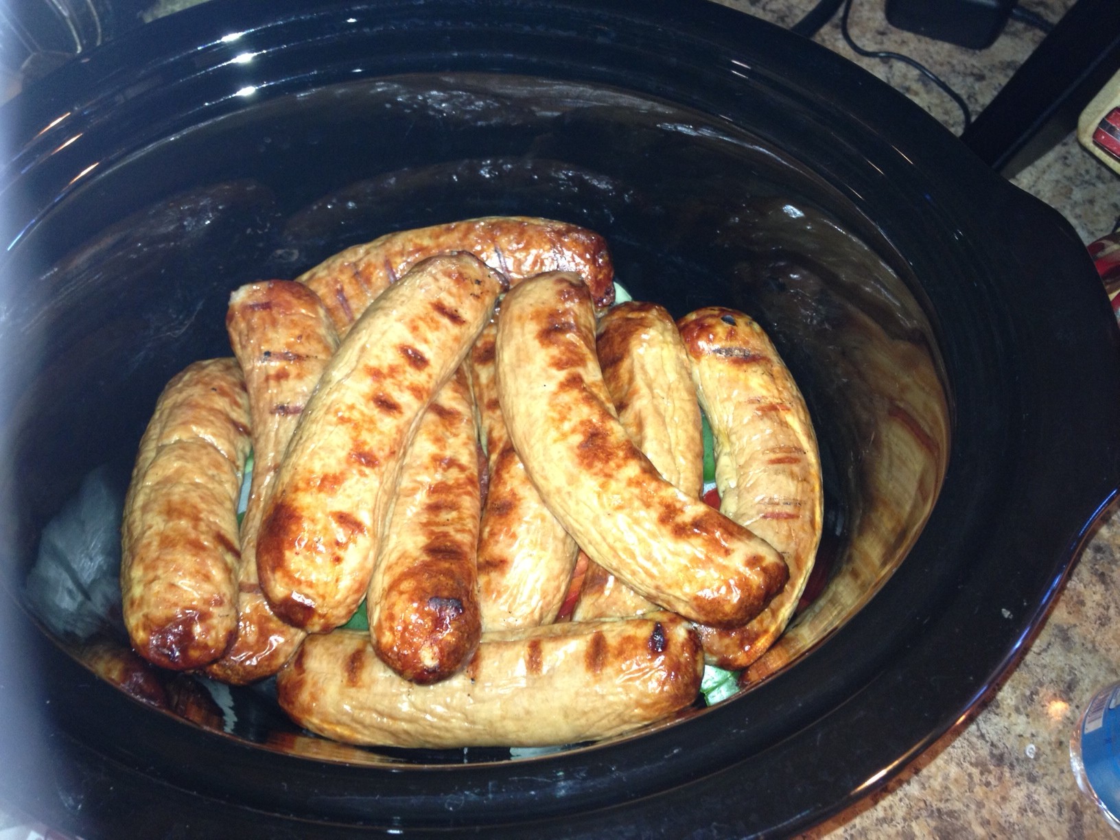Crock Pot Barbecued Beer Brats with Onions and Peppers.