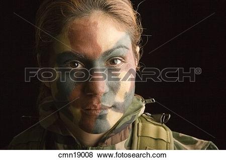 Pictures of Close up of female soldier with camouflage face paint.