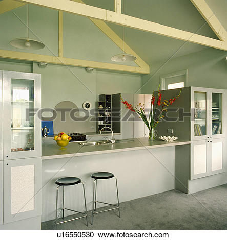 Stock Photography of Stools at breakfast bar in modern grey.
