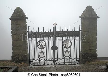 Stock Photography of Small Cemetery Gate in Fog.