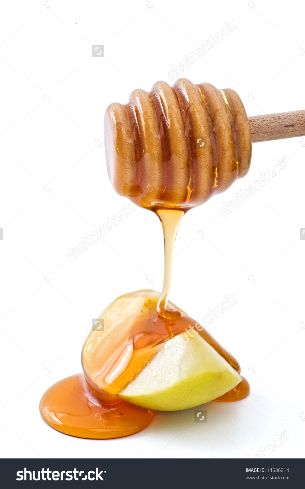 Honey Dripping On A Green Apple Slice Isolated On White Stock.