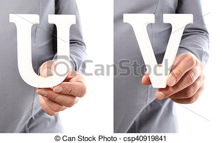 Stock Photo of Hands holding letter U and V from alphabet isolated.