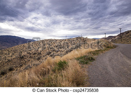 Stock Photos of Grey storm clouds gathering over a mountain.
