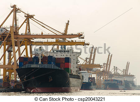 Stock Photo of Container Cargo freight ship with working crane.