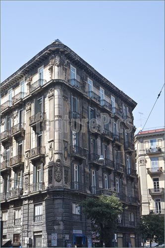 An old corner apartment or hotel building in Naples Italy, italian.