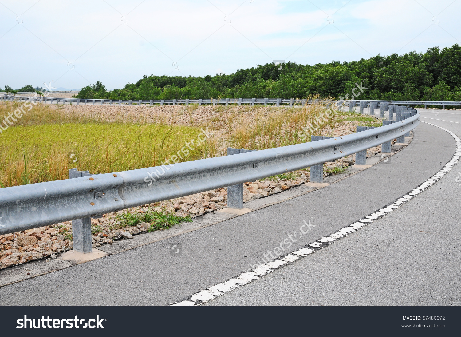 Highway Passing Through Countryside Crash Barrier Stock Photo.