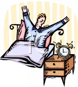 A Man Yawning and Stretching As His Alarm Clock Dings.