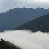 Stock Photo of Fog over town, Trongsa District, Bhutan u93337894.