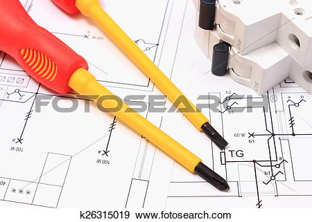 Stock Photograph of Screwdriver and electric fuse on construction.