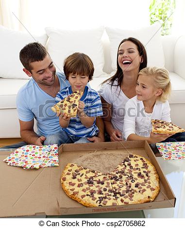 Stock Photo of Smiling family eating pizza in living.