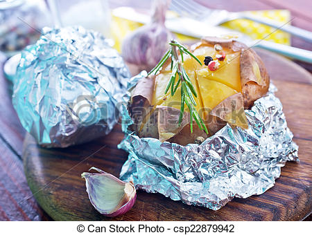 Stock Photo of baked potato in foil csp22879942.