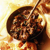 Stock Photo of Thick Sauced Lamb Curry With Spinach,Garlic And.