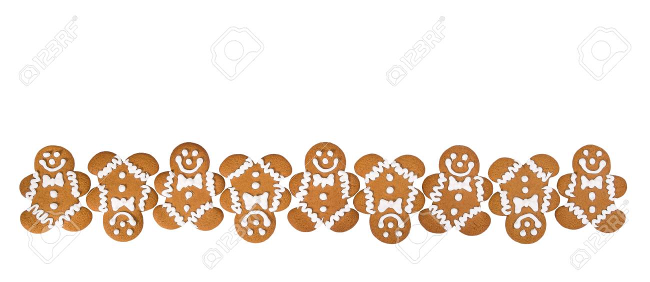 A row of Gingerbread Men cookies isolated on white background...