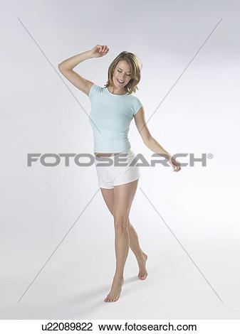 Stock Photo of Woman wearing white shorts and a t.