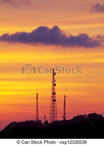 Stock Photos of Golden sky with telecommunication tower on top of.