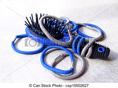 Stock Photo of Elastic hair bands and a hair brush.