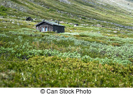 Stock Images of Wooden Huts and a House on a Hillside.