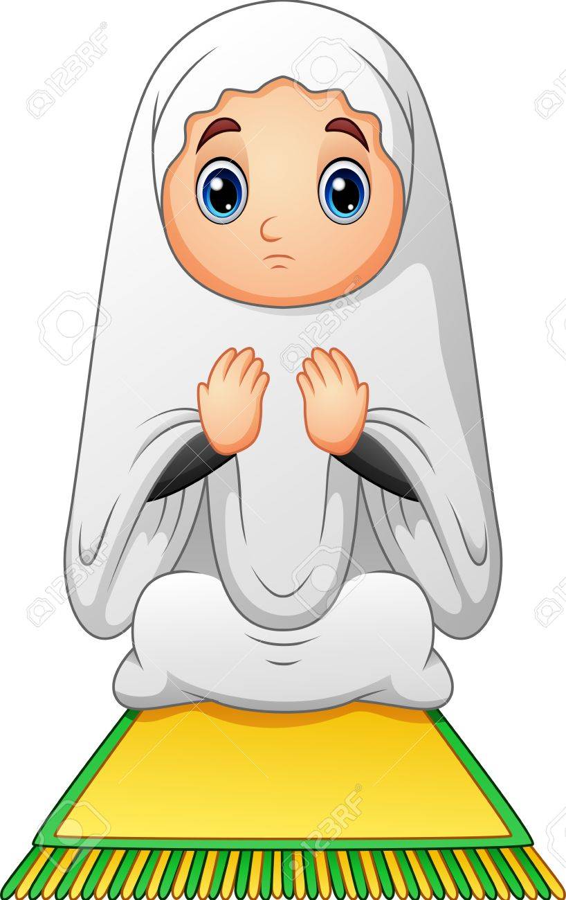 Muslim girl sitting on the prayer rug while praying.