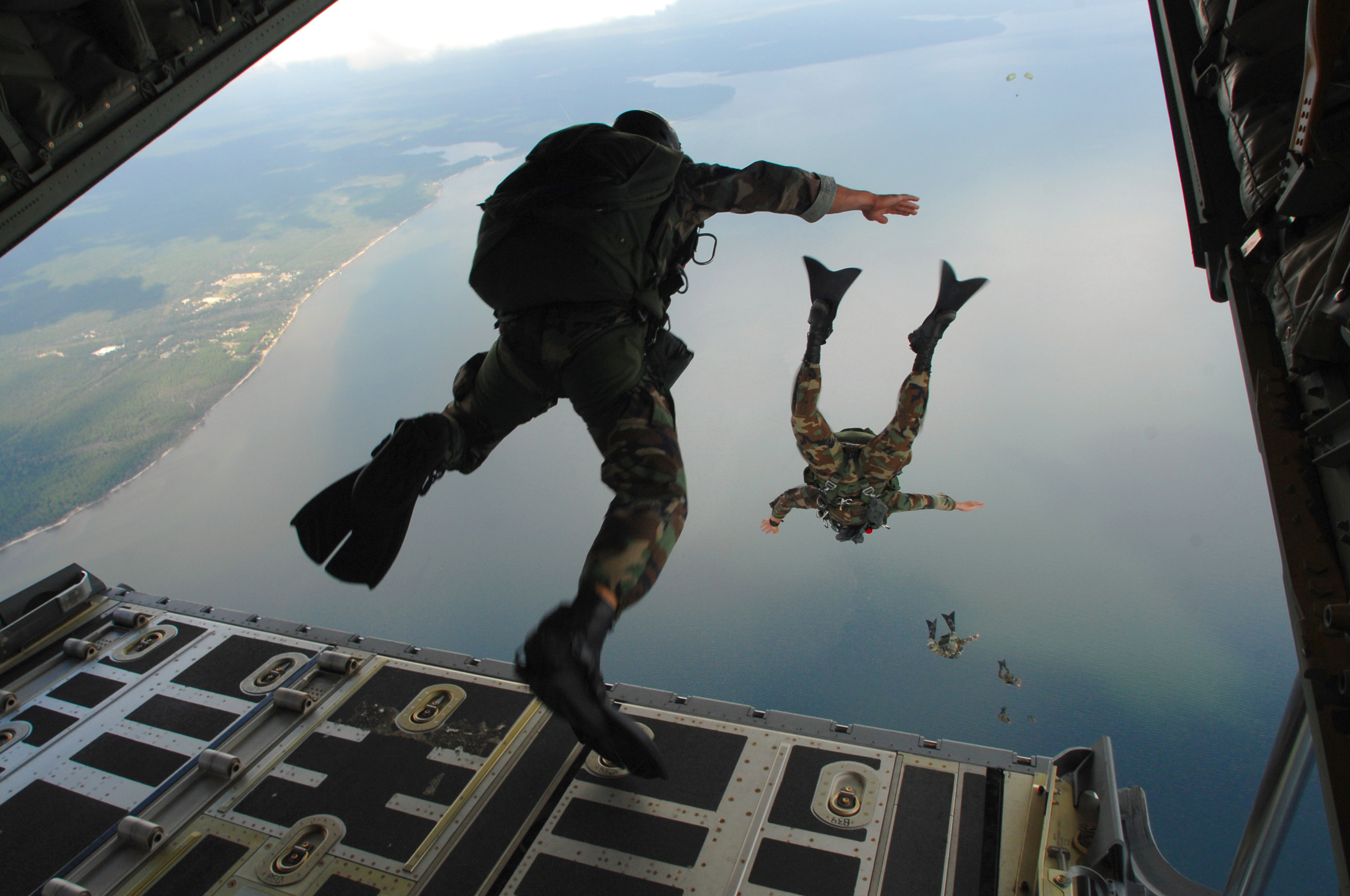 Plane Dropping Paratroopers Clipart.