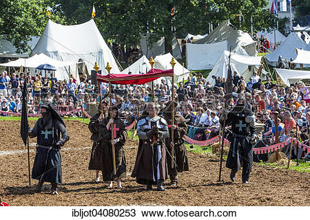 Stock Photo of Medieval spectacle, joust with knights' camp and.