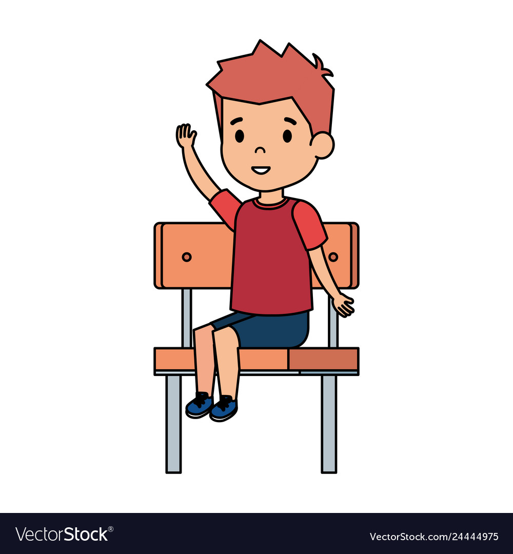 Cute little boy sitting in schoolchair.