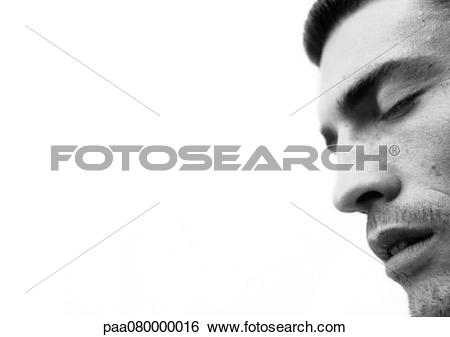 Stock Images of Man's face with eyes closed and mouth open, close.