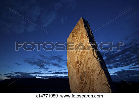 Stock Photograph of Deer stone marker, a standing stone with marks.