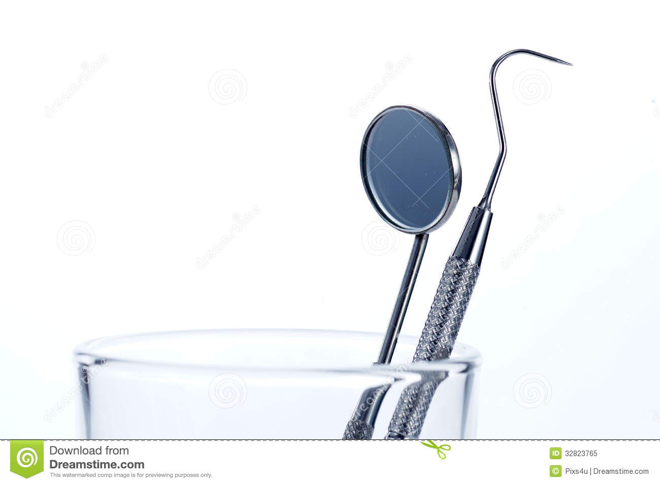 Two Dental Tools In The Glass : Dental Mirror And Probe Royalty.