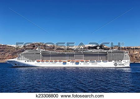 Stock Photography of MSC Fantasia cruise ship near Santorini.