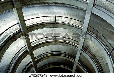 Stock Photograph of Spiralling multi storey car park, elevated.