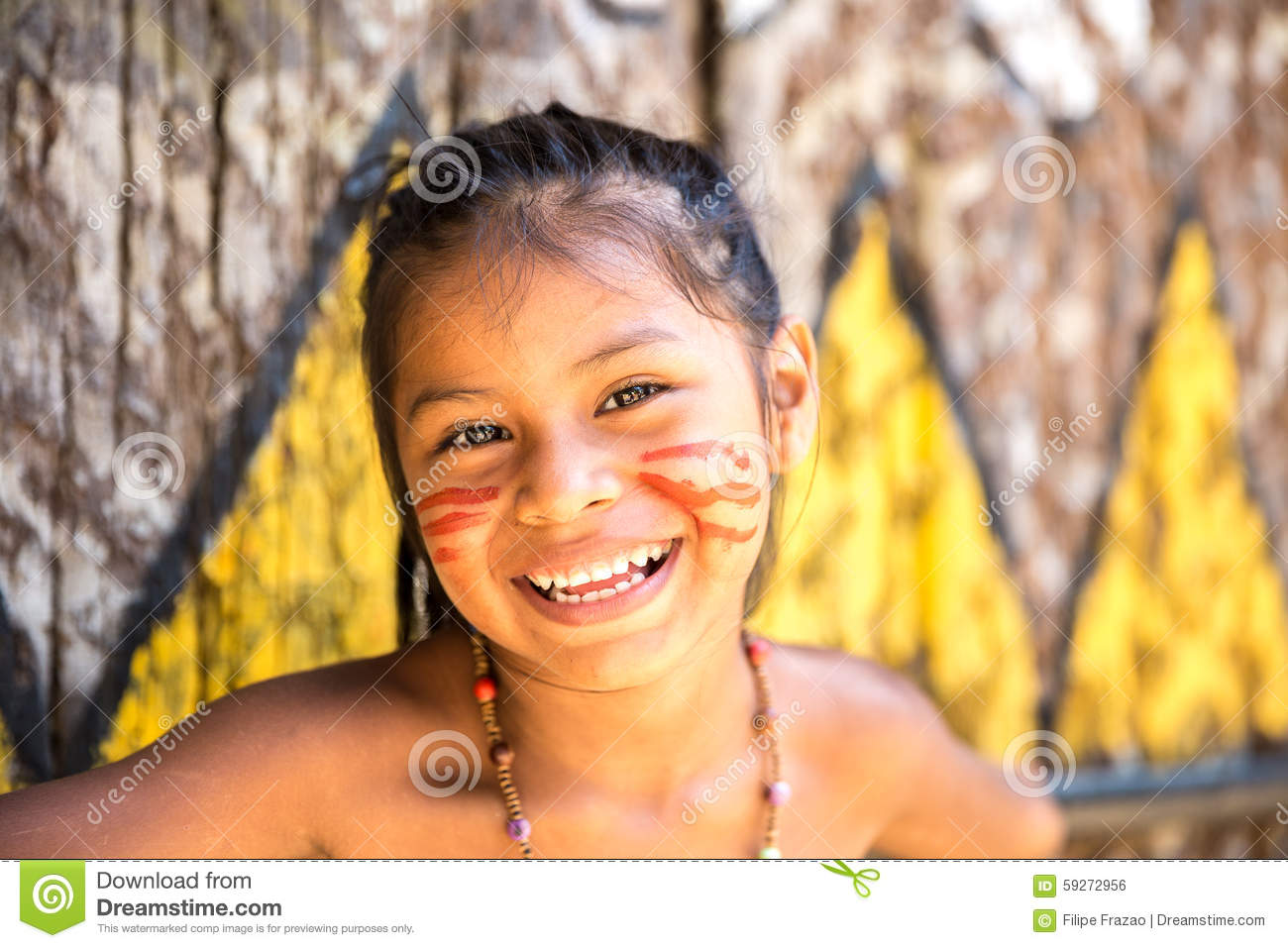 Native Brazilian Girl Smiling At An Indigenous Tribe In The Amazon.