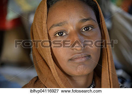 Picture of Young girl from a nomadic tribe, wearing headgear.