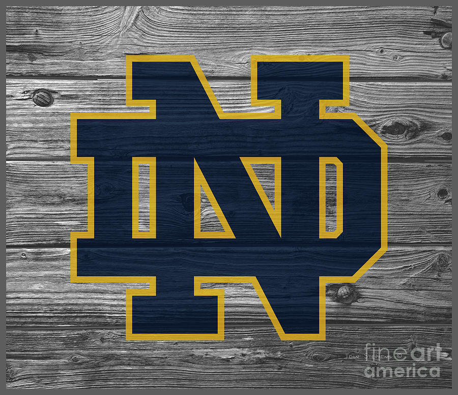 University Of Notre Dame Fighting Irish Logo On Weathered Wood.