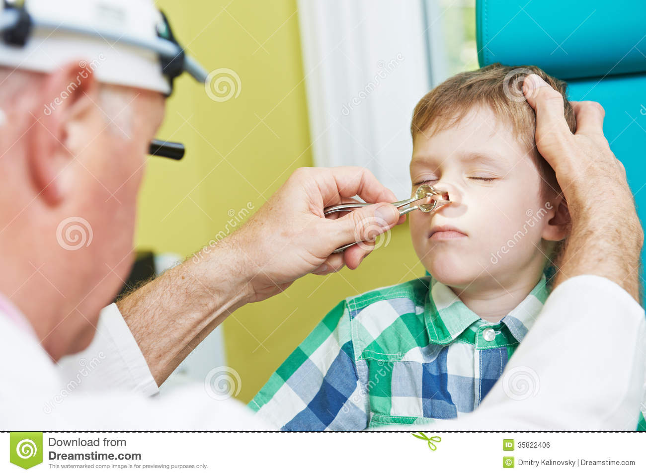 Otolaryngologist Ear Nose Throat Doctor Rinsing Nose At Boy Child.