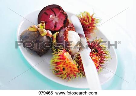 Stock Image of Mangosteen, partly peeled, and rambutans 979465.