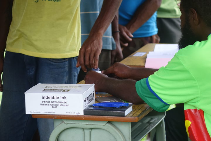 PNG election official arrested.