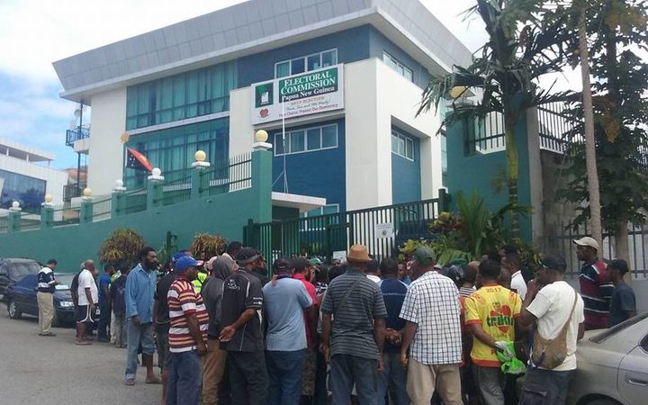 Senior election officials detained in PNG.