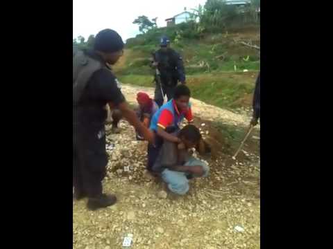 Police Brutality in Papua New Guinea (Beating, kicking women & men).