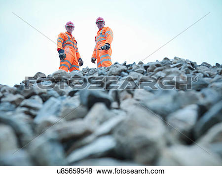 Pictures of Portrait of quarryman and assistant standing on.