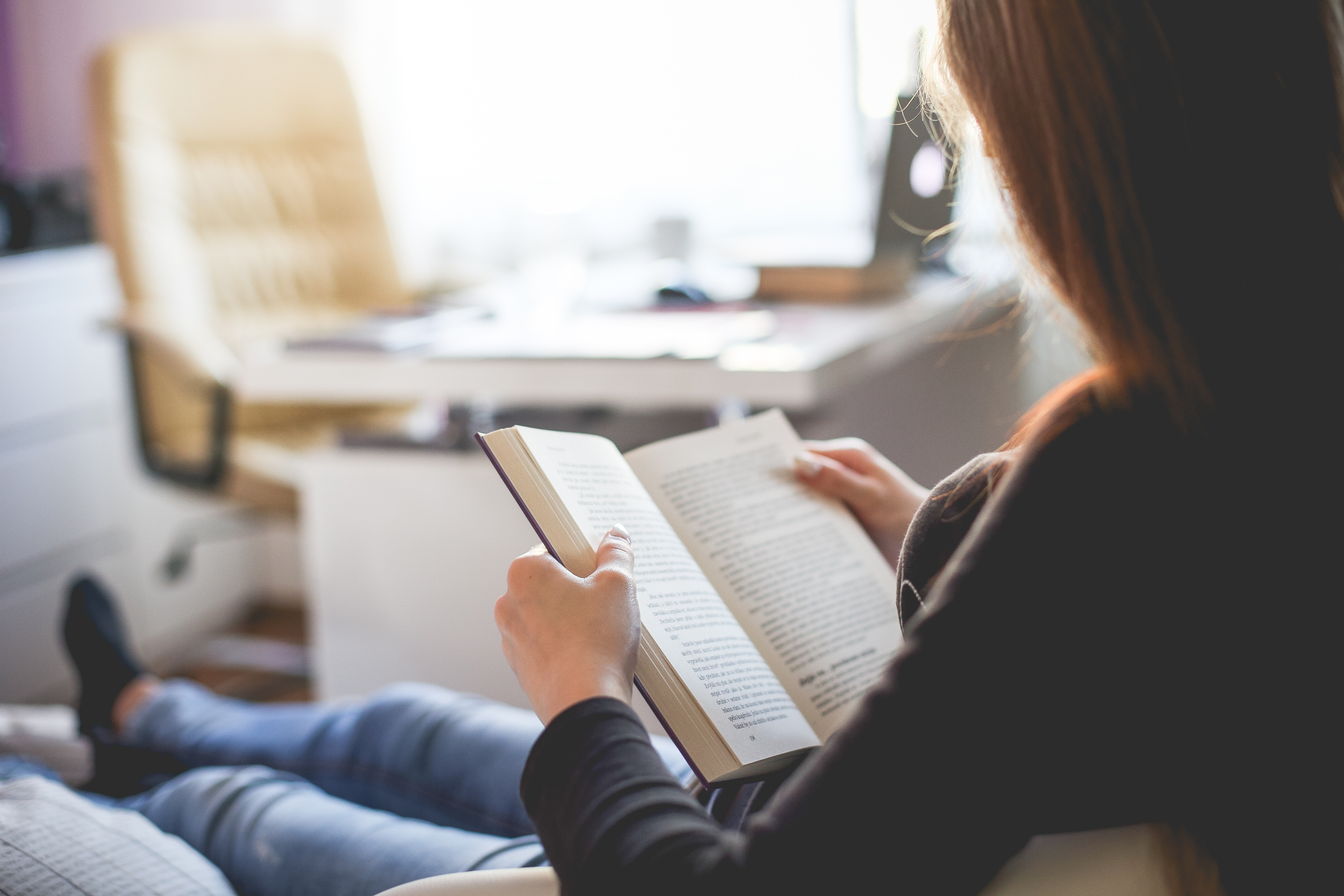 Girl Reading a Book at Home Free Stock Photo Download.